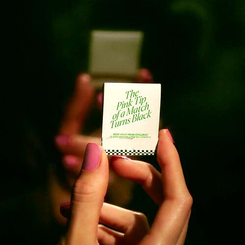 The Pink Tip Of A Match Turns Black